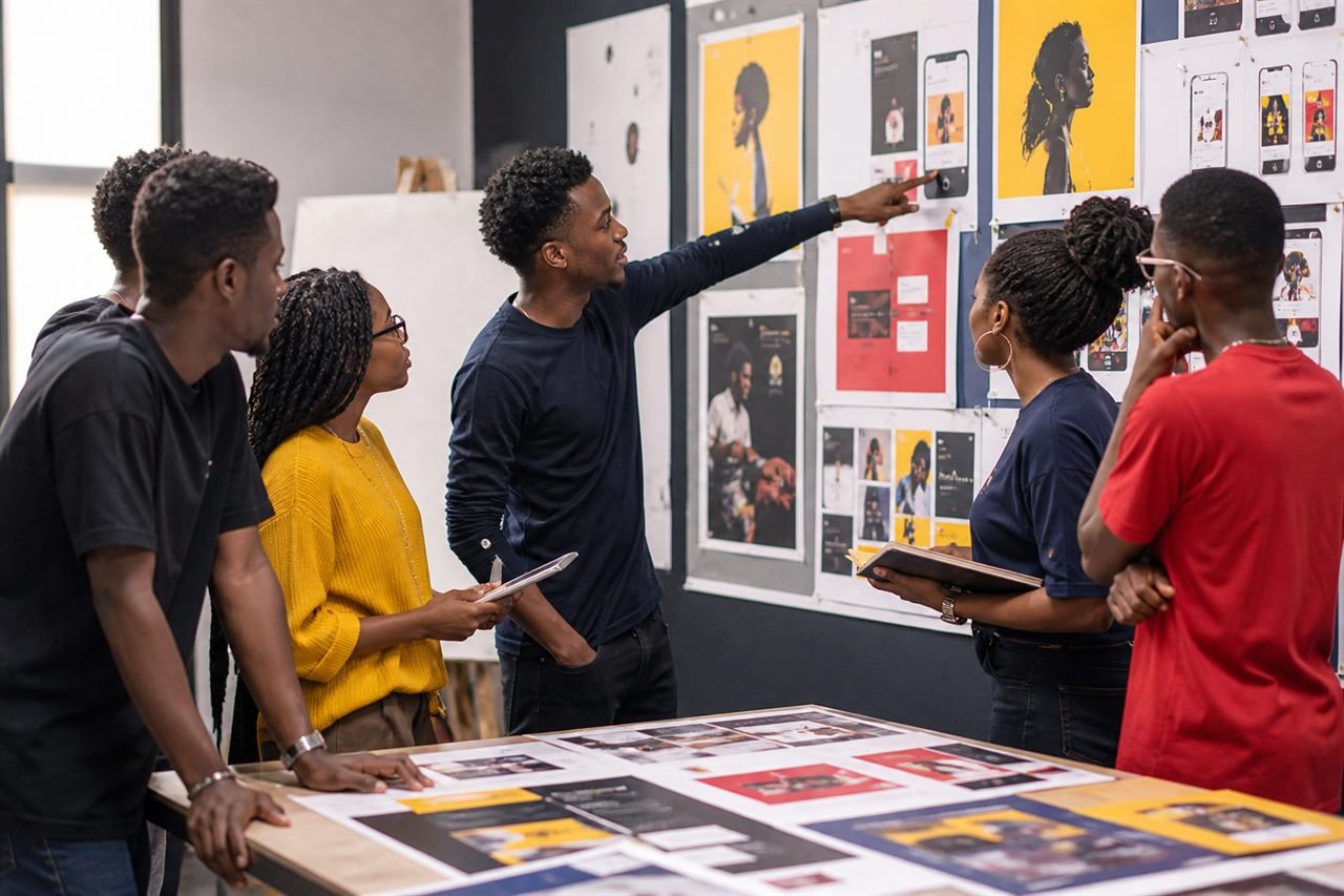 Students reviewing campaign mockups.